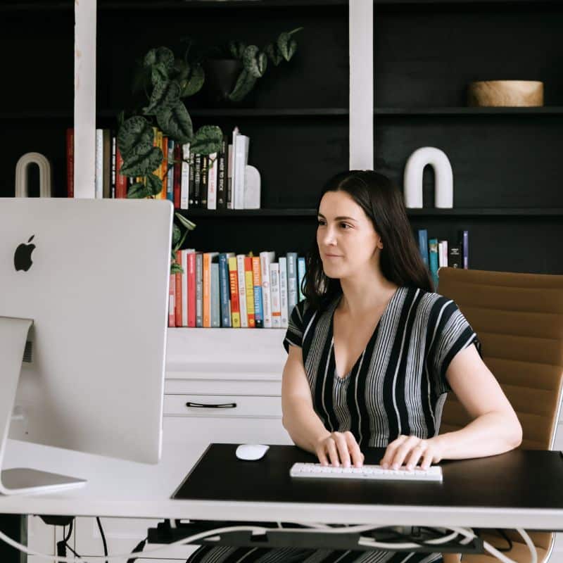 Woman working on Mac computer
